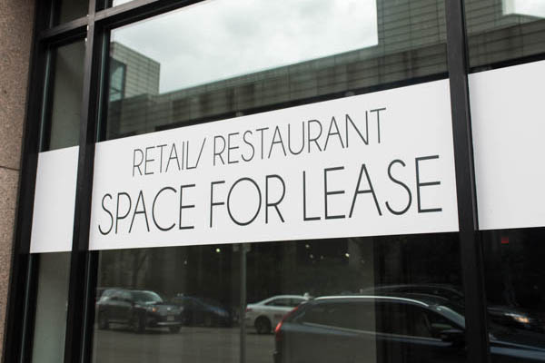 Commercial Lease Lawyer - Working on commercial lease - For lease sign on window